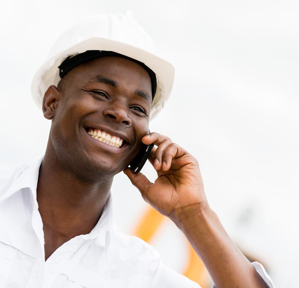 Architect talking on the phone at a construction site